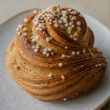 Laminated cardamom bun finished with pearl sugar